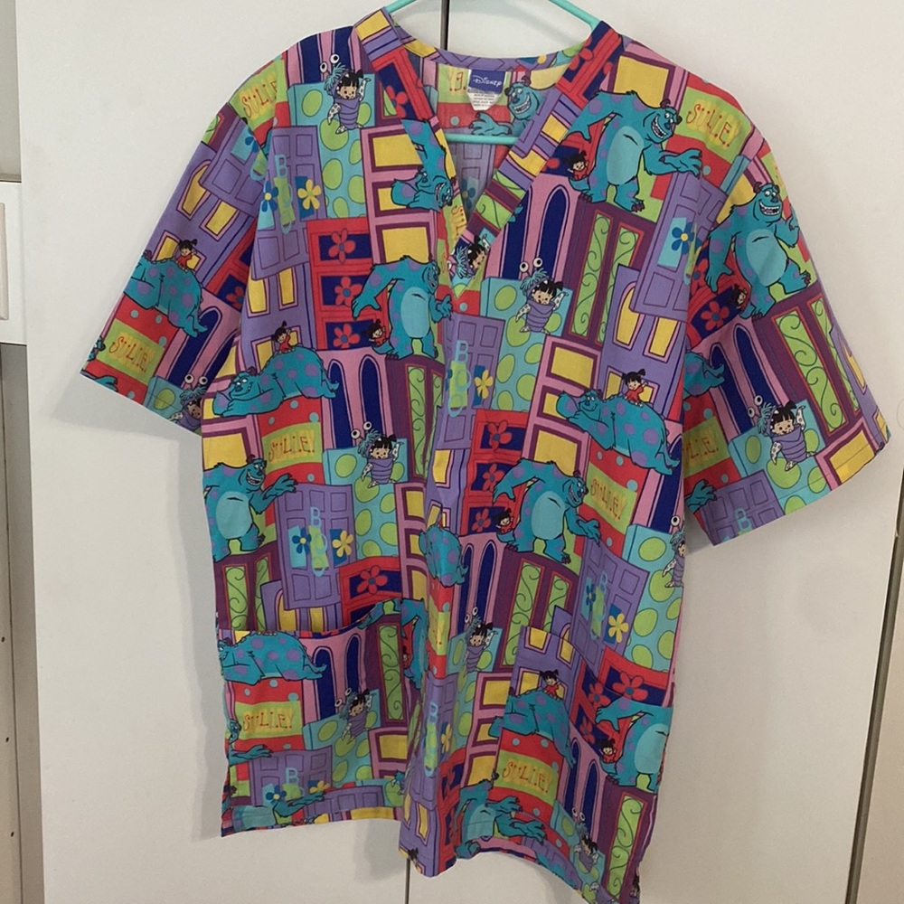 Disney’s Monsters’ Inc. scrub top, Size M